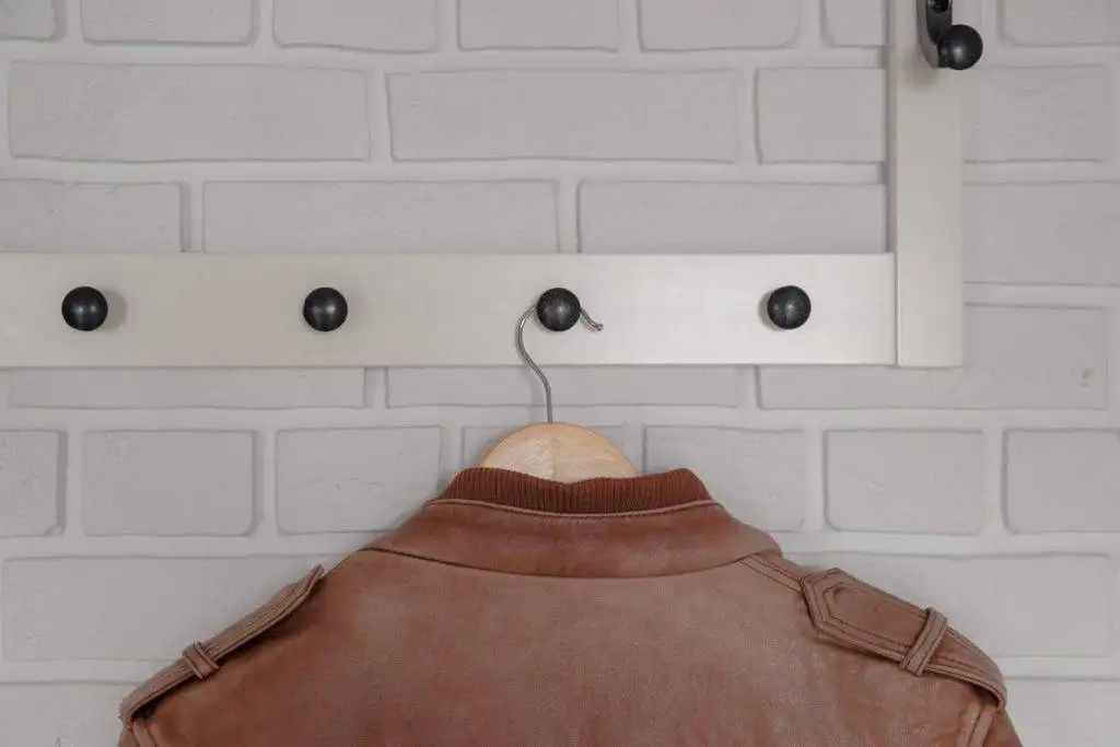 leather-jacket-hanging-in-a-hanger-1024x683.webp